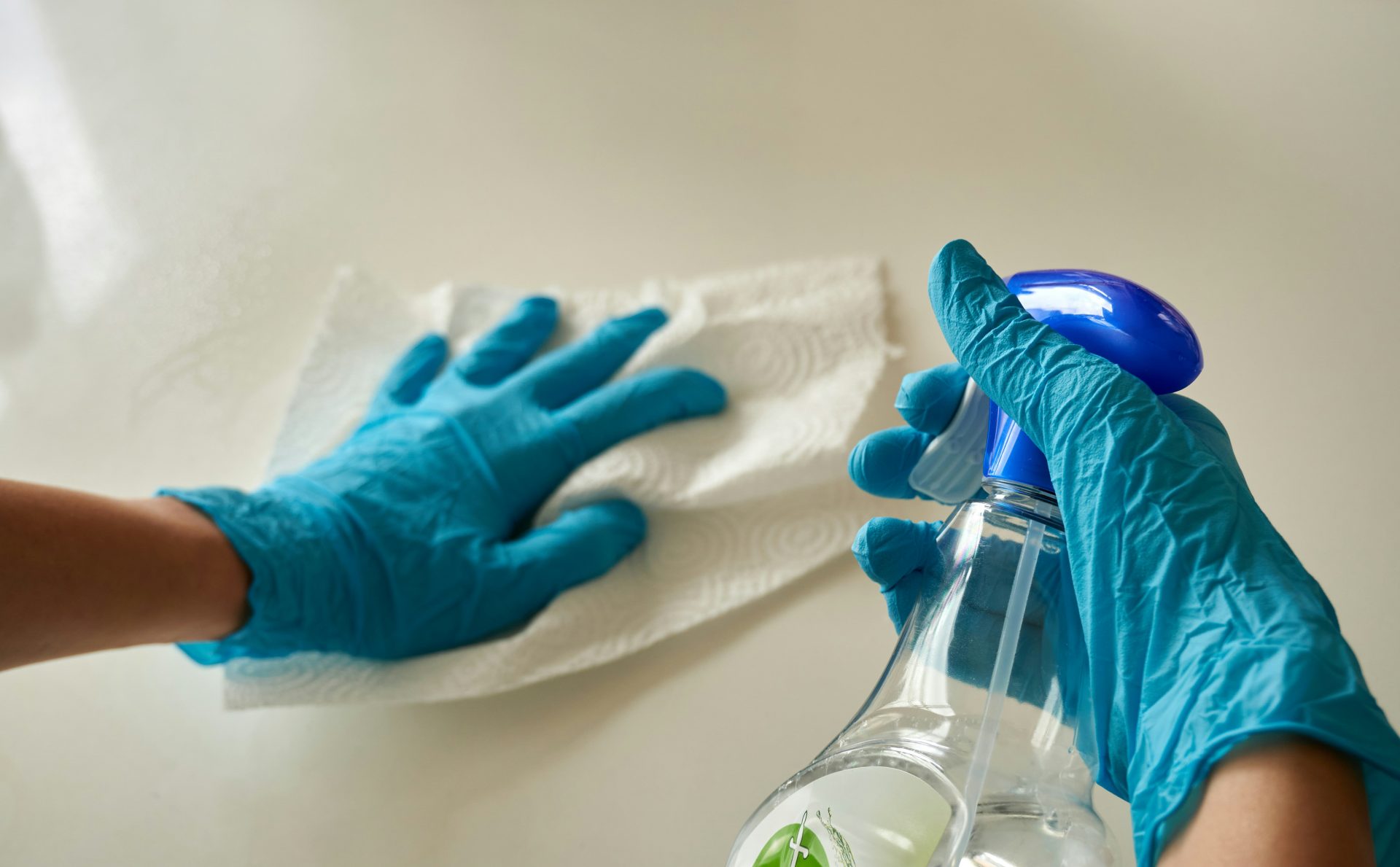 Countertop cleaning with gloves and eco-friendly cleaner